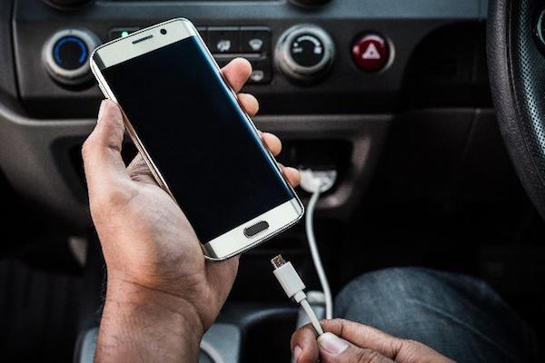 Modern car console with USB plugs for passengers.
